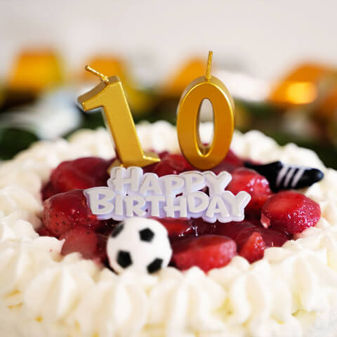 Cake decoration, soccer shoes and a ball